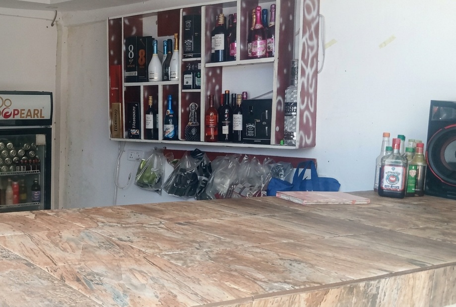 Close-up of the pub bottle shelves and wall displays.